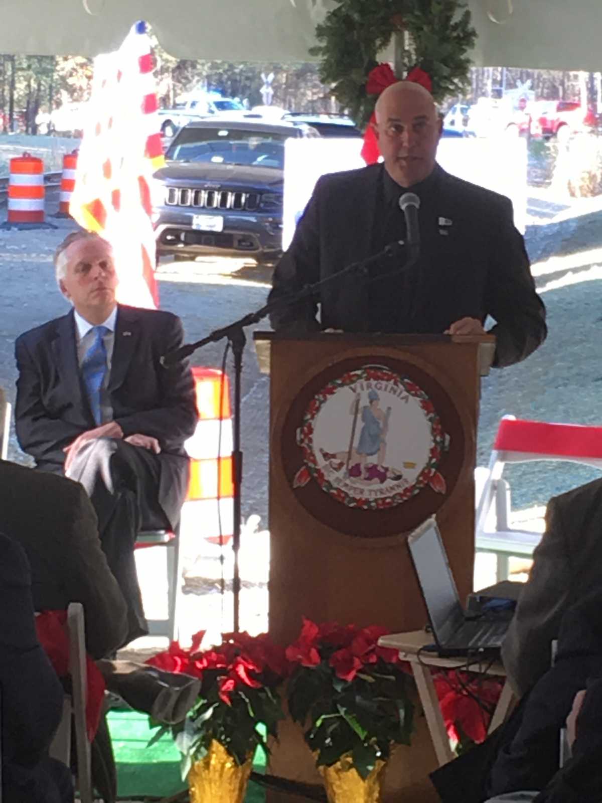 HRTAC Chair Hipple Speaking at Podium